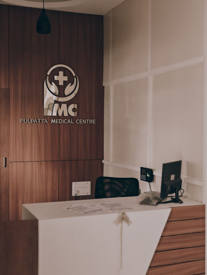 Warm and inviting medical center reception showcasing contemporary design with wood panel accents.